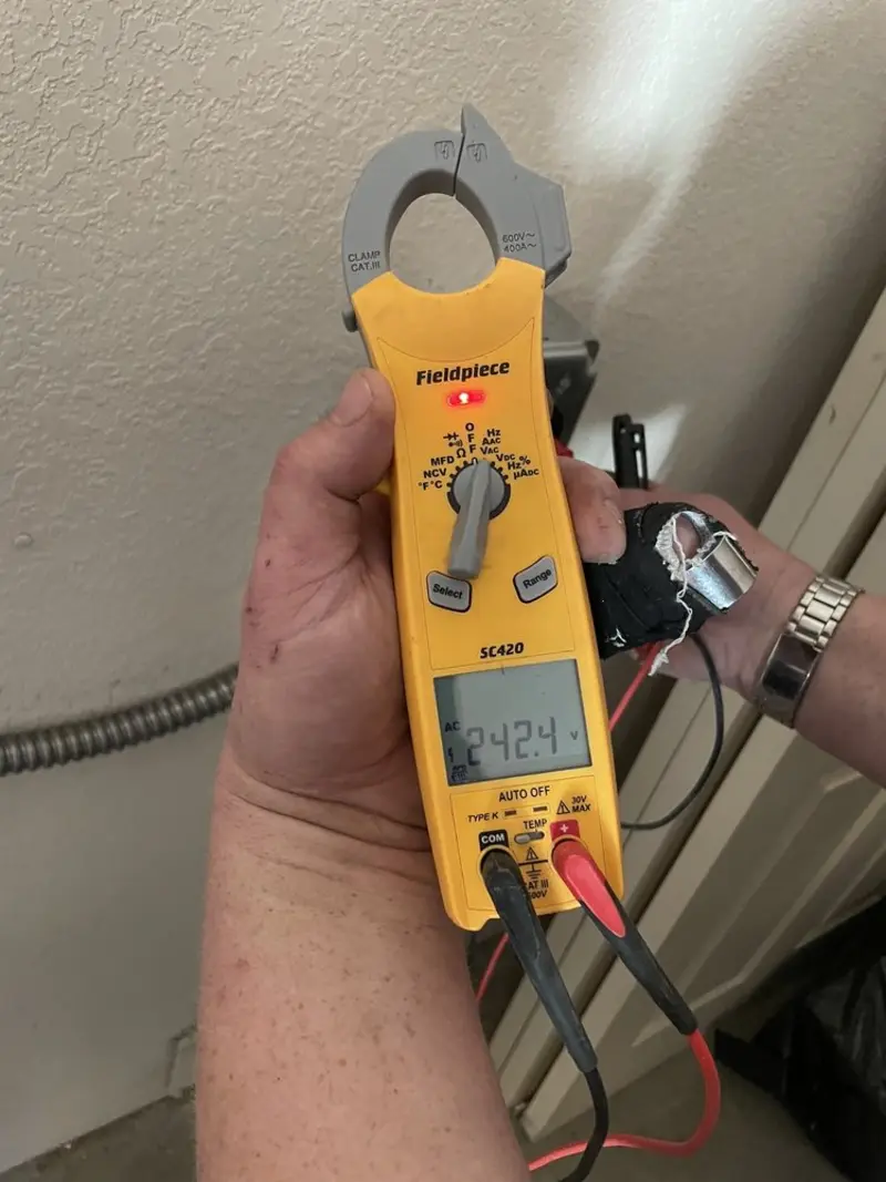 Voltage testing with clamp meter during Outlet Installation in Vermilion